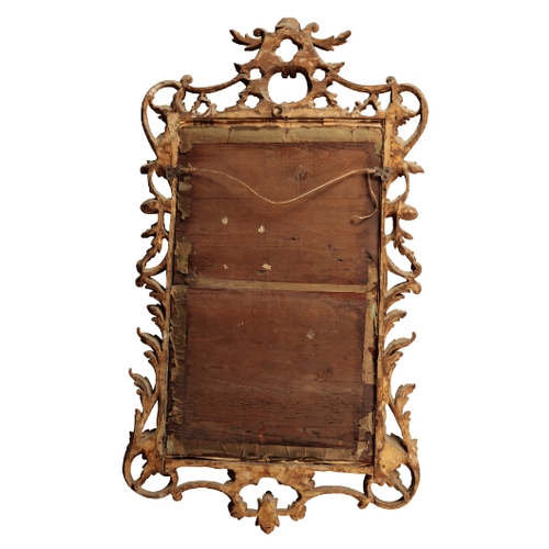 108 - A GEORGE II GILTWOOD MIRROR Mid-18th century, the rectangular plate in a pierced foliate frame, surm... 