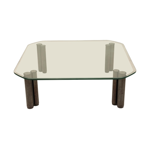 427 - LARGE ITALIAN GLASS TOPPED COFFEE TABLE the rectangular top with canted corners raised on four pairs... 