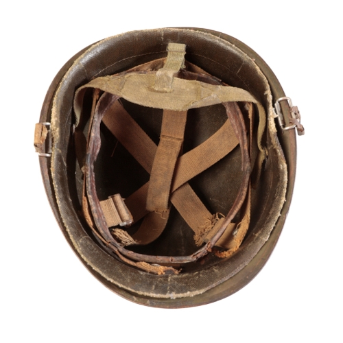 45 - AN AMERICAN MILITARY HELMET, with canvas and leather lining, stamped no. inside 46325, marked 82