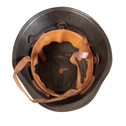 49 - A WWII GERMAN MILITARY FIRE HELMET with leather chin-strap