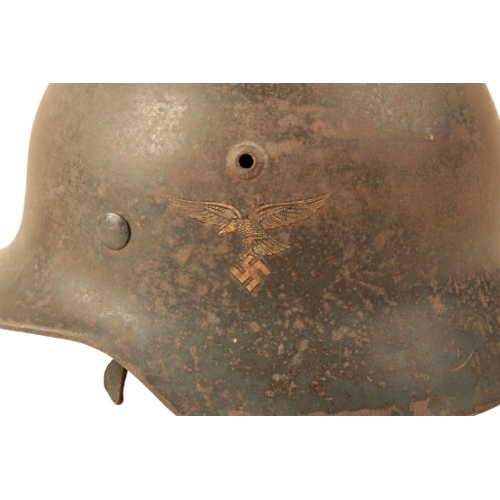 52 - A WWII GERMAN M35 DOUBLE DECAL LUFTWAFFE HELMET with original leather liner and chin strap, with own... 