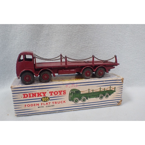 145 - A DINKY TOYS 905 'FODEN FLAT TRUCK AND 965 'EUCLID REAR DUMP TRUCK' two broken rails on the flat tru... 