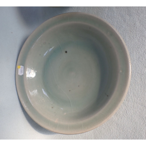 249 - A CELADON GLAZED DISH AND A ROBIN'S EGG GLAZED BOWL with similar items