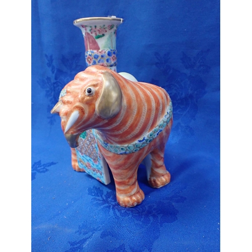 298 - A CHINESE FAMILLE ROSE VASE IN THE FORM OF AN ELEPHANT highly decorated in enamels (damaged)