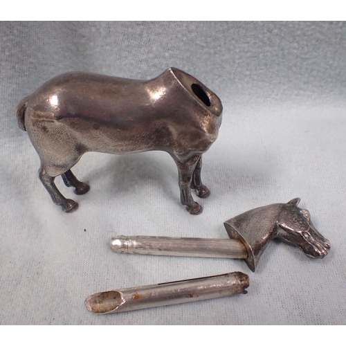 342 - A WHITE METAL NOVELTY HORSE TABLE LIGHTER (?) with two silver napkin rings, another lighter and othe... 