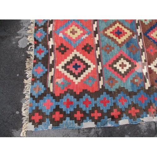 616 - A LARGE KILIM RUG 187 x 335cm (worn, patched, unevenly faded)