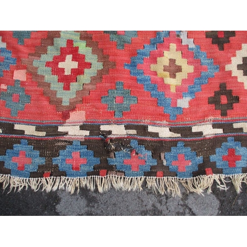 616 - A LARGE KILIM RUG 187 x 335cm (worn, patched, unevenly faded)