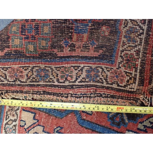 617 - AN ANTIQUE BIJAR RUG 128 x 222cm (frayed, worn) and a Turkmen Asmalyk bag face, possibly Yomut (2)