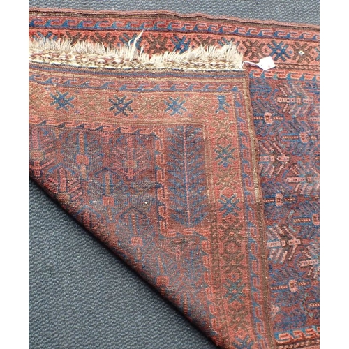 620 - A BELUCH PRAYER RUG, BLUE AND RED 92 x 140cm, plus fringes, old stencilled number to back (wear, pat... 