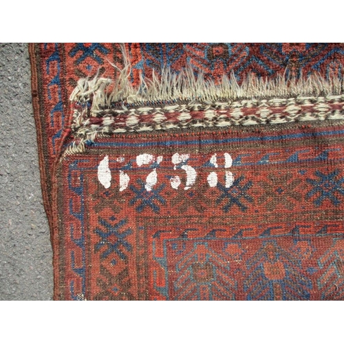 620 - A BELUCH PRAYER RUG, BLUE AND RED 92 x 140cm, plus fringes, old stencilled number to back (wear, pat... 