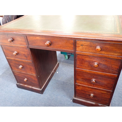 667 - A VICTORIAN MAHOGANY DESK, OF SMALL PROPORTIONS with nine drawers with wooden knobs, corresponding d... 