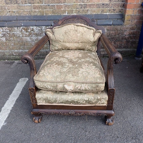 710 - A 1920S BERGERE THREE-PIECE SUITE the mahogany frame carved with bird's heads, bellflower, and scrol... 