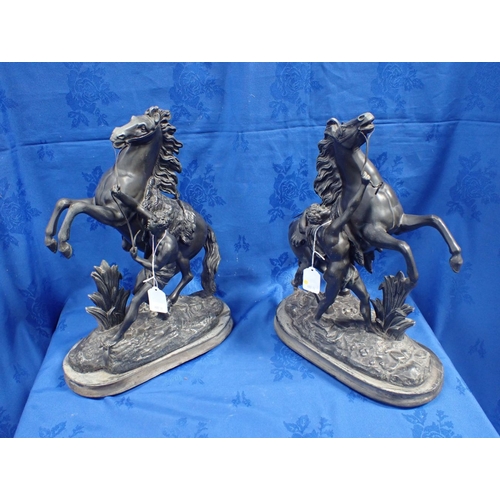 113 - A PAIR OF PATINATED SPELTER 'MARLY' HORSES 44cm high