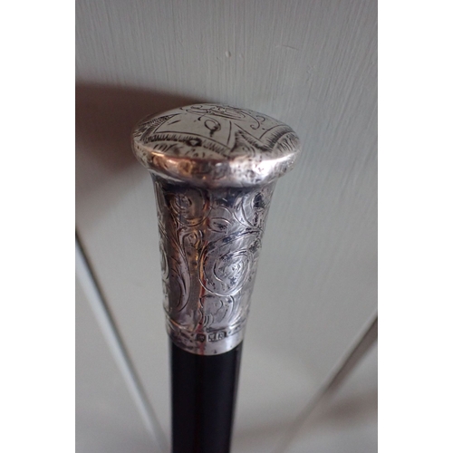 124 - A HALLMARKED SILVER-TOPPED WALKING CANE and a 'hedgerow' walking stick (2)