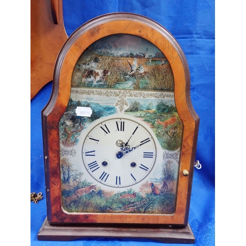 171 - A FRANKLIN MINT 'WILDLIFE' MANTEL CLOCK (not running) and a reproduction weight driven wall clock (w... 