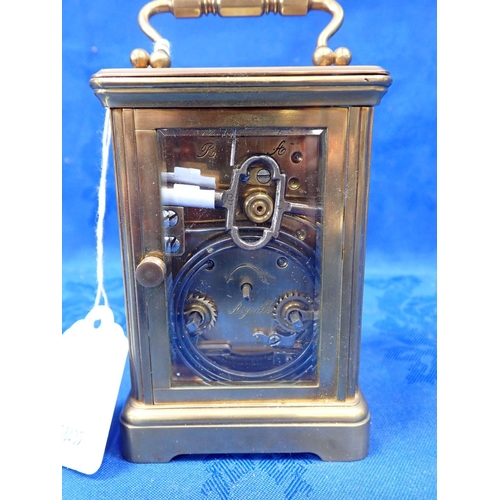 175 - A FRENCH CARRIAGE CLOCK WITH STRIKE on a gong 11cm high (working, damage to side glasses)