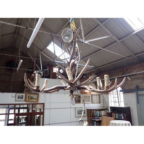 193 - A KITSCH BARONIAL STYLE 'ANTLER' SIX-BRANCH CHANDELIER (cast resin) 80cm wide, 60cm drop (including ... 