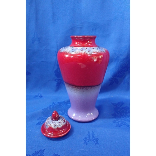 287 - KAREN R. FORD FOR POOLE POTTERY, A VASE AND COVER 25cm high