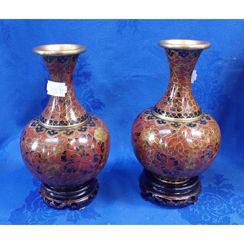 310 - A PAIR OF ORIENTAL CLOISONNE VASES ON WOODEN STANDS and a pair of Japanese relief decorated vases