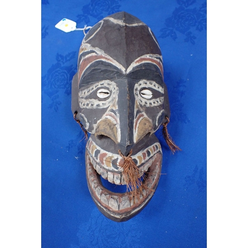 342 - A PAPUA NEW GUINEA PAINTED WOOD HEAD 20th century, together with a Papua New Guinea sand painting (2... 