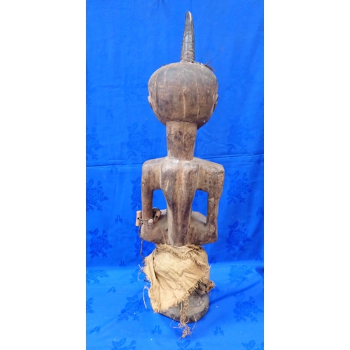 347 - A LARGE AFRICAN TRIBAL STATUE WITH A STUDDED FACE 92cm high