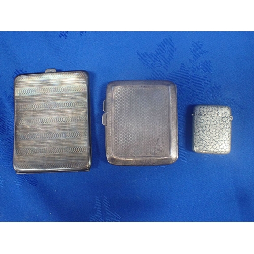 373 - TWO SILVER CIGARETTE CASES AND A WHITE METAL VESTA CASE