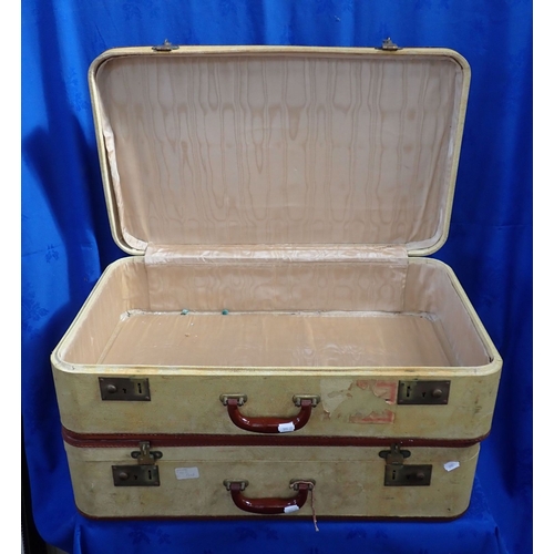 86 - A PAIR OF MID-20TH CENTURY SUITCASES with brown leather trim