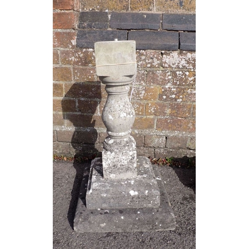 10 - A RECONSTITUTED STONE BIRD BATH 67cm high, 47cm diam.