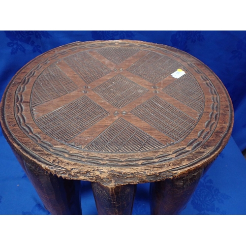 137 - AN AFRICAN NUPE TRIBAL STOOL 33cm diam,28.5cm high (damaged)