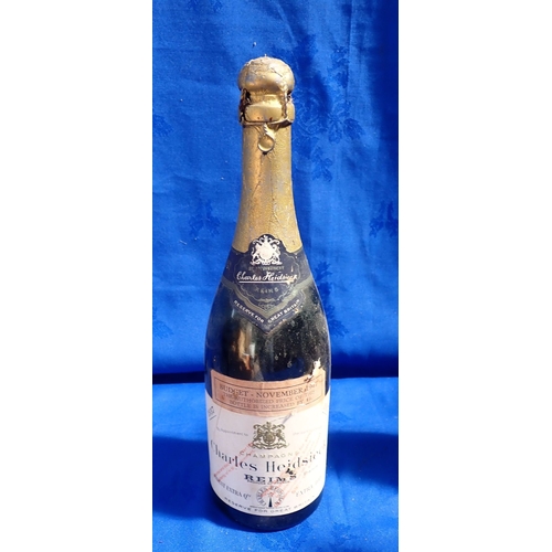 196 - A 1937 'CHARLES HEIDSIECK' EXTRA DRY CHAMPAGNE some leakage, together with a 1991 Brut Roche Lacour,... 