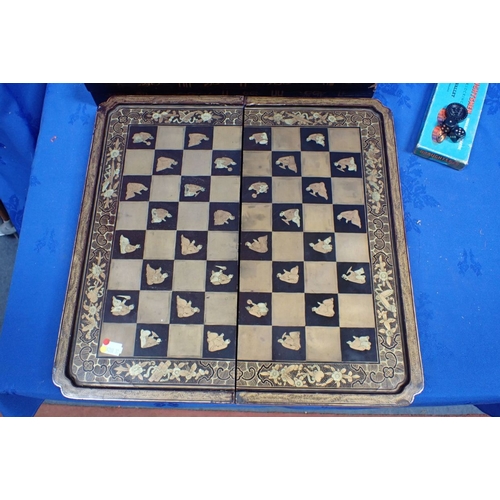 202 - A CHINESE LACQUERED GAMES BOX another similar (some damage), and a 19th century mahogany cribbage bo... 