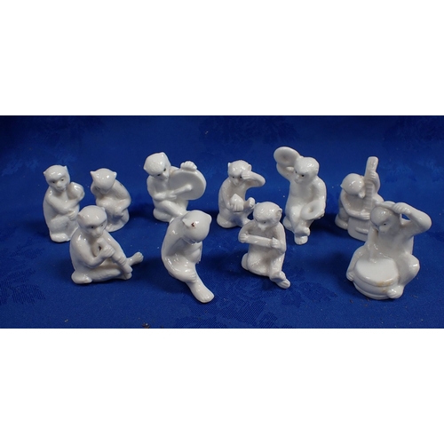 245 - A WHITE PORCELAIN MONKEY BAND -10