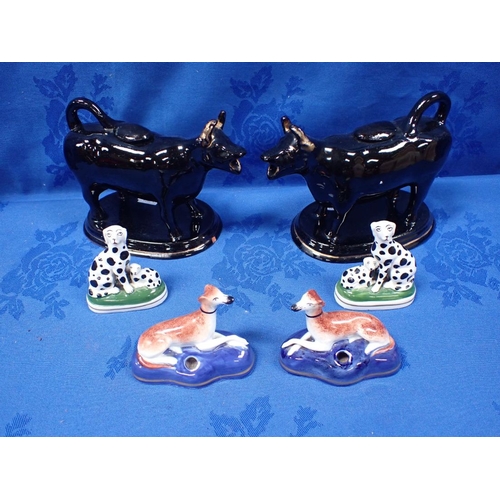 247 - A PAIR OF PORCELANEOUS STAFFORDSHIRE STYLE GREYHOUND PENHOLDERS a similar pair of Dalmatians, and tw... 