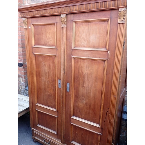 685 - A 19TH CENTURY CONTINENTAL WARDROBE 127cm wide (doors need re-hanging)