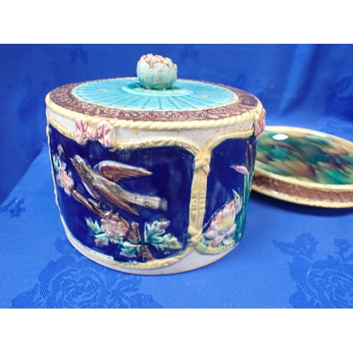 236 - A 19TH CENTURY MAJOLICA CHEESE DISH decorated with birds and bulrushes (crazed, the base cracked)