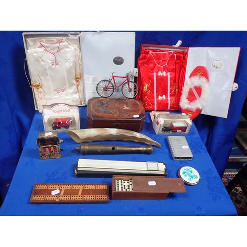 109 - TWO BOXED FAR EASTERN PYJAMA SETS with other items including a lacquer box, a slide rule, draughts s... 