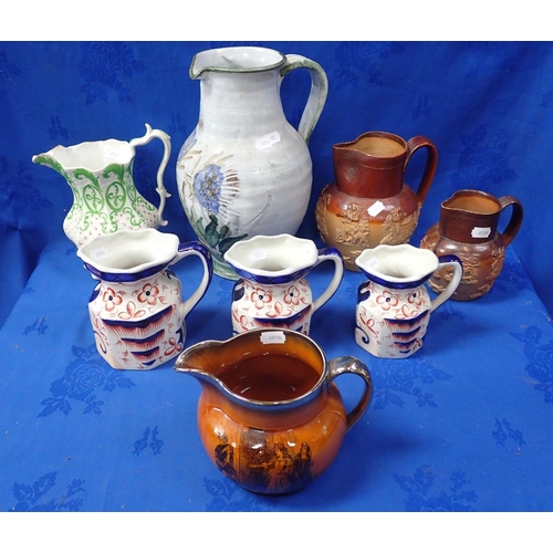 111 - A GROUP OF VICTORIAN AND LATER JUGS with a Scottish studio jug decorated with sgrafitto thistles