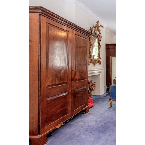 840 - A GEORGE III STYLE MAHOGANY LINEN PRESS 