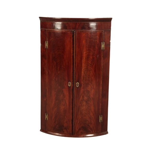 848 - A GEORGE III MAHOGANY BOW-FRONT HANGING CORNER CUPBOARD 