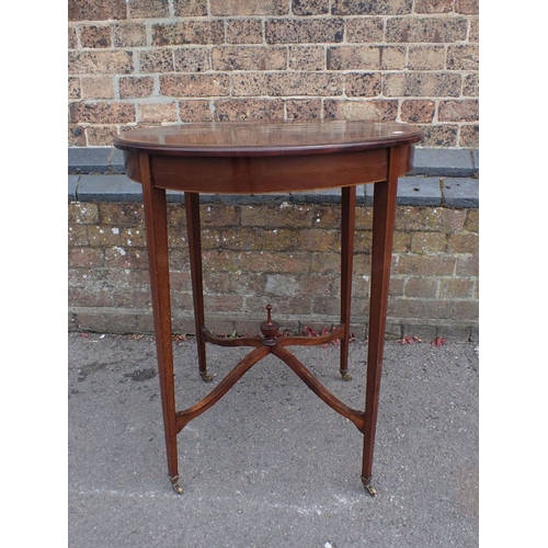 855 - AN EDWARDIAN MAHOGANY WINDOW TABLE with crossbanded circular top, and shaped stretchers with urn fin... 