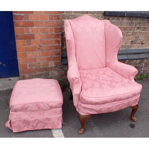 859 - A REPRODUCTION GEORGE II STYLE WING ARMCHAIR upholstered in damask, with pink damask loose covers, a... 