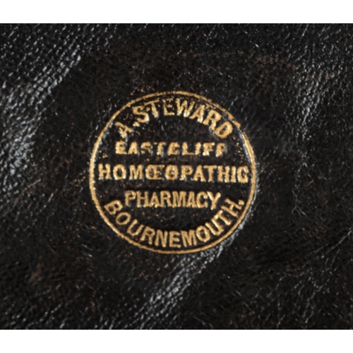 123 - A WALNUT MEDICINE BOX FROM EASTCLIFFE HOMEOPATHIC PHARMACY, BOURNEMOUTH stamped to the interior of t... 