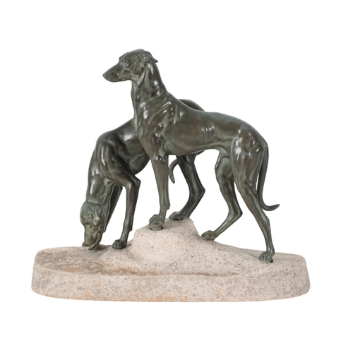 126 - AFTER JULES EDMOND MASSON (1871-1932) A pair of greyhounds mounted on a naturalistic sandstone base,... 