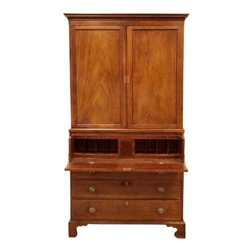 130 - AN EDWARDIAN MAHOGANY SECRETAIRE PRESS the moulded pediment over cupboard doors, opening to an inter... 