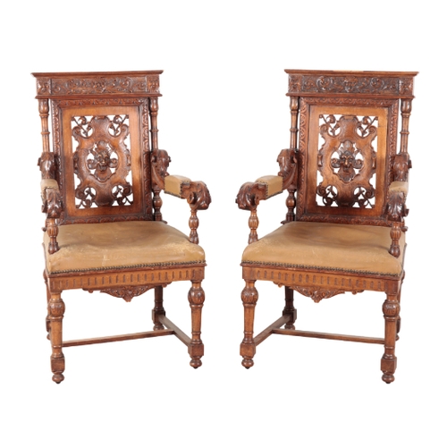 145 - A SET OF SIX VICTORIAN OAK DINING CHAIRS 19th century, including two armchairs, each with heavily ca... 