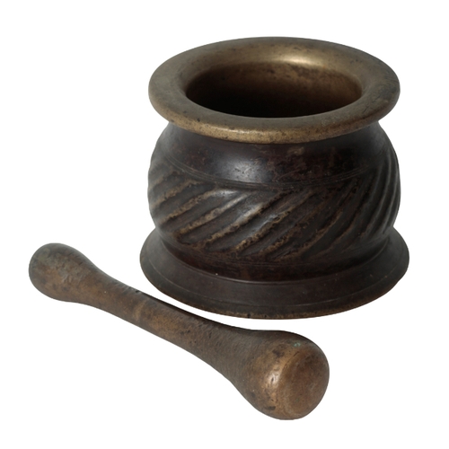 258 - A 16TH CENTURY HISPANO-MOORESQUE BRONZE PESTLE AND MORTAR the mortar with an out-turned rim, flatten... 