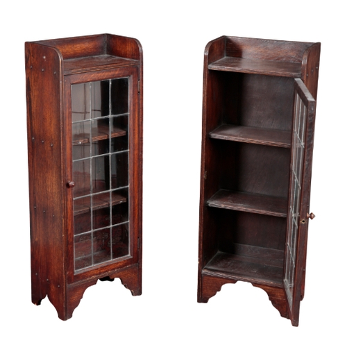 260 - A PAIR OF 1930'S OAK LEADED GLAZED BOOKCASES with gallery tops and fitted two drawers, each 100cm hi... 