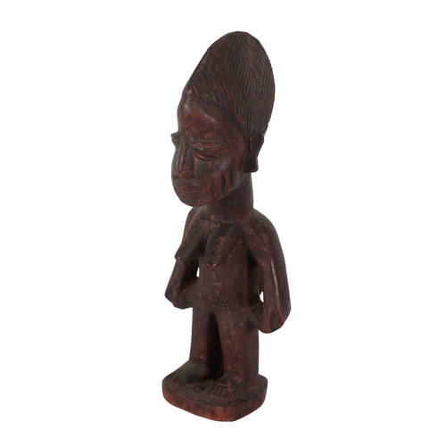 262 - AN AFRICAN WOODEN HEADREST carved to sides with entwined knot motifs, 18cm high and an African Dogon... 