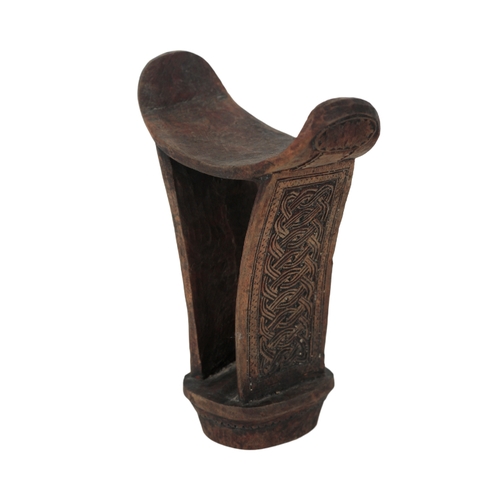 262 - AN AFRICAN WOODEN HEADREST carved to sides with entwined knot motifs, 18cm high and an African Dogon... 