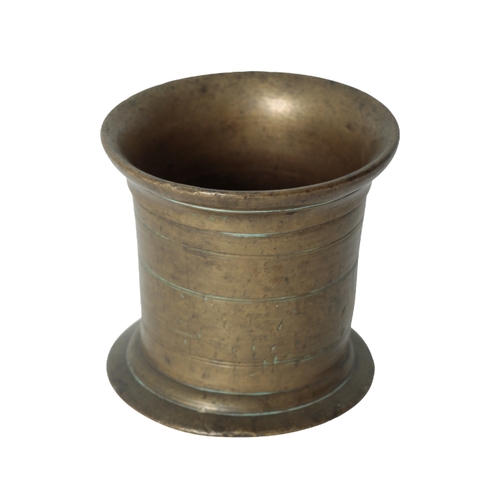 265 - AN ENGLISH 18TH CENTURY BRONZE PESTLE AND MORTAR the out turned rim above a turned body, engraved wi... 